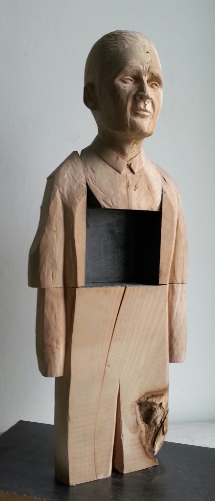 Smoking Man. Lime wood carving with paper and graphite by Lee Devonish, 2015
