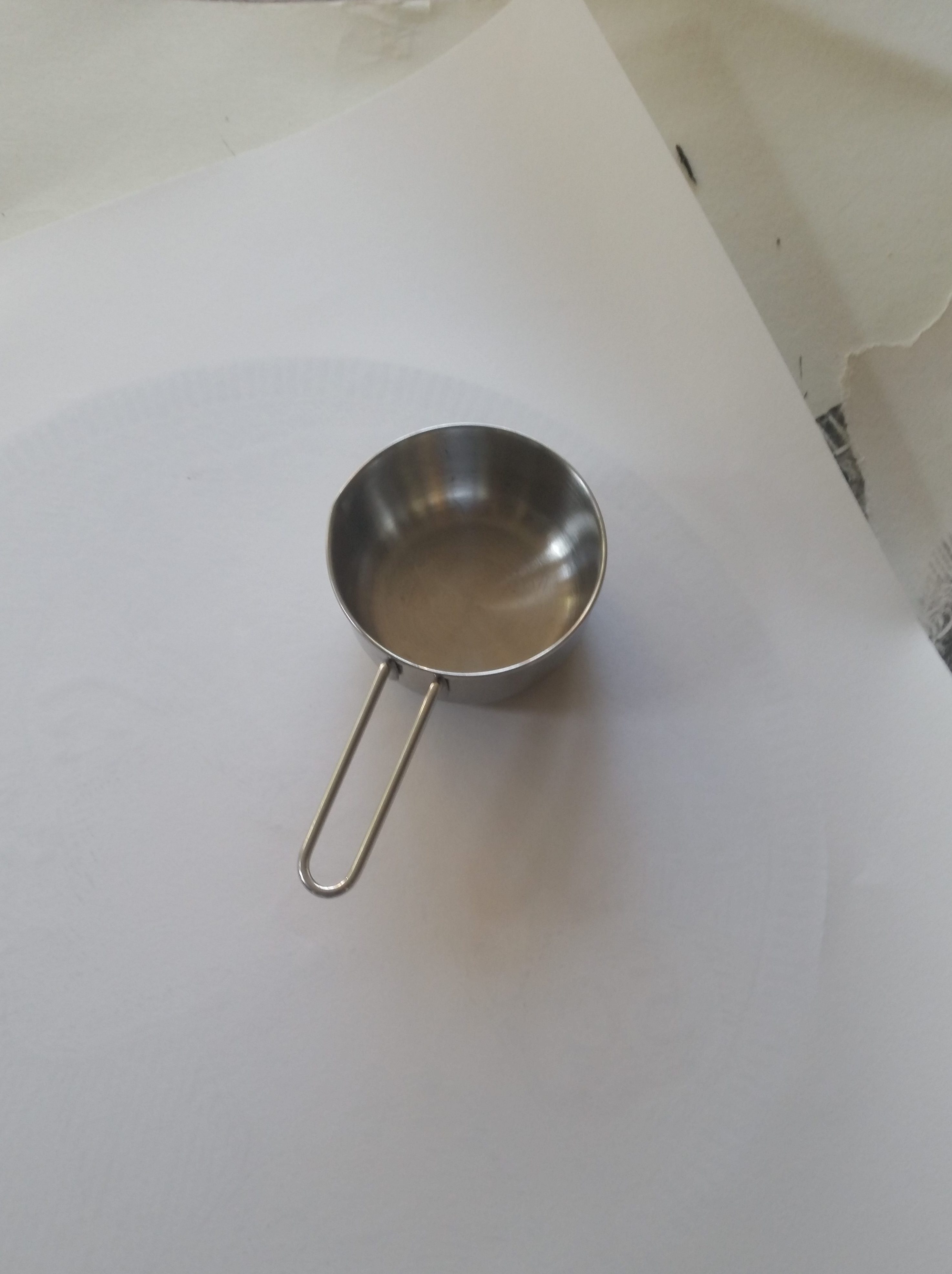 Using a measuring cup as a baren.
