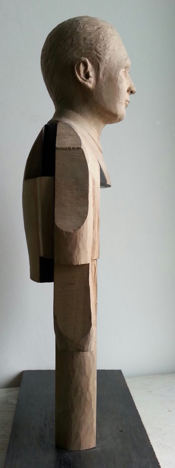 Smoking Man. Lime wood carving with paper and graphite by Lee Devonish, 2015.