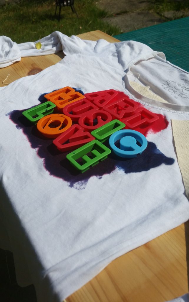 UV dye exposing in sunlight on white t shirt