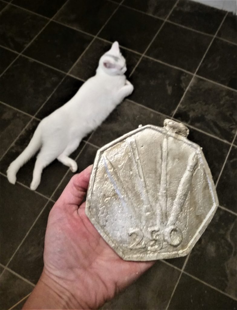 First semi-successful pewter casting, obverse side.