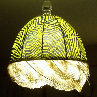 Batik lampshade with guinea fowl feathers.