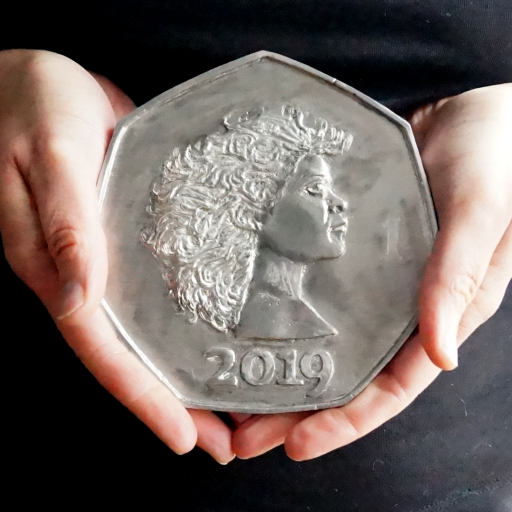 250, a large pewter coin by Lee Devonish