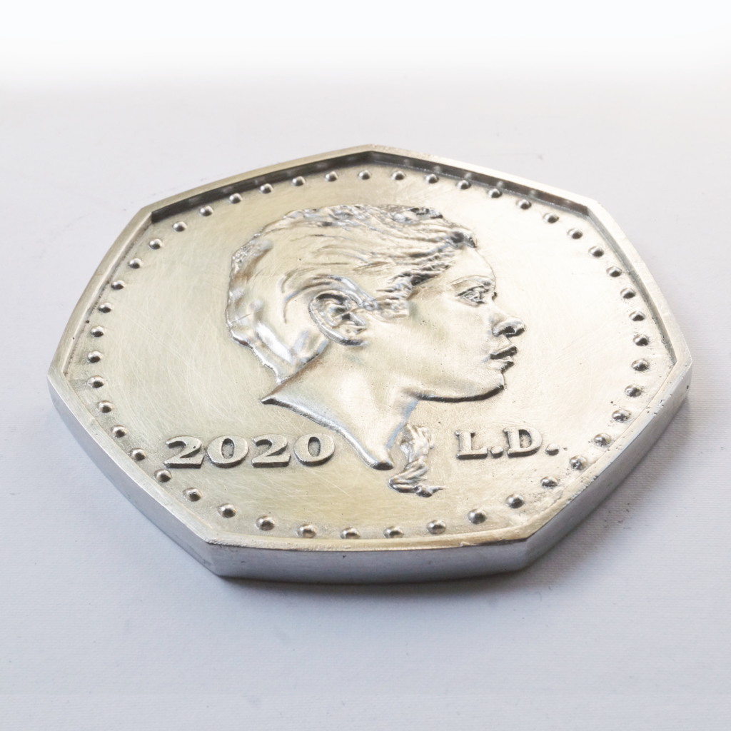 250 • cast pewter coin by Lee Devonish, 2020. 250 is an original sand-cast pewter coin artwork featuring obverse and reverse side low relief sculpture.