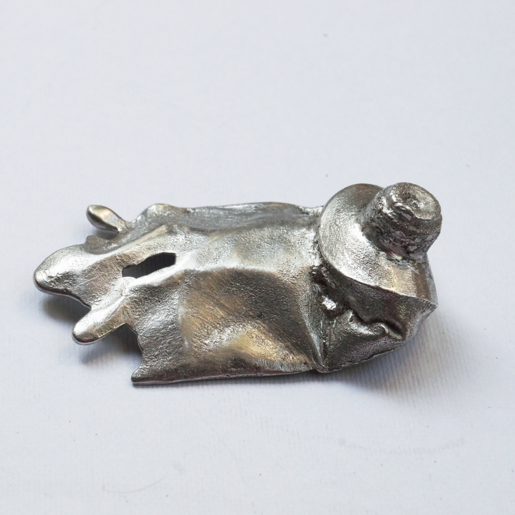 Pewter paint tube pendant appearing to turn into paint drips