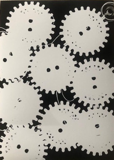Photogram of thread reels and a bobbin